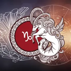 Symbol Koziorożca, który jest znakiem zodiaku 3 stycznia, w otoczeniu kryształów i koła zodiaku.