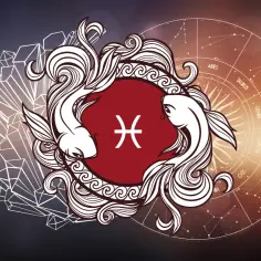Dwa ryby symbolizujące znak zodiaku Ryby, który przypada na 22 luty. W tle koło zodiaku i kryształy.