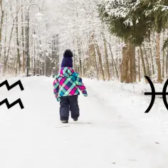 Dziecko w zimowym parku, obok symbole Wodnika i Ryb. 19 luty znak zodiaku.