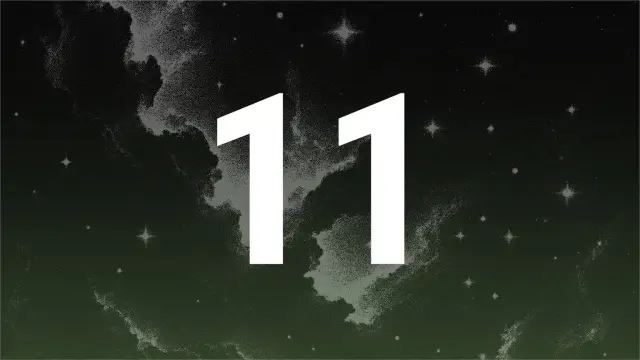 Białe cyfry 11 na tle nocnego nieba z gwiazdami i mgławicami. 11:44 znaczenie – czas na refleksję i nowe początki.